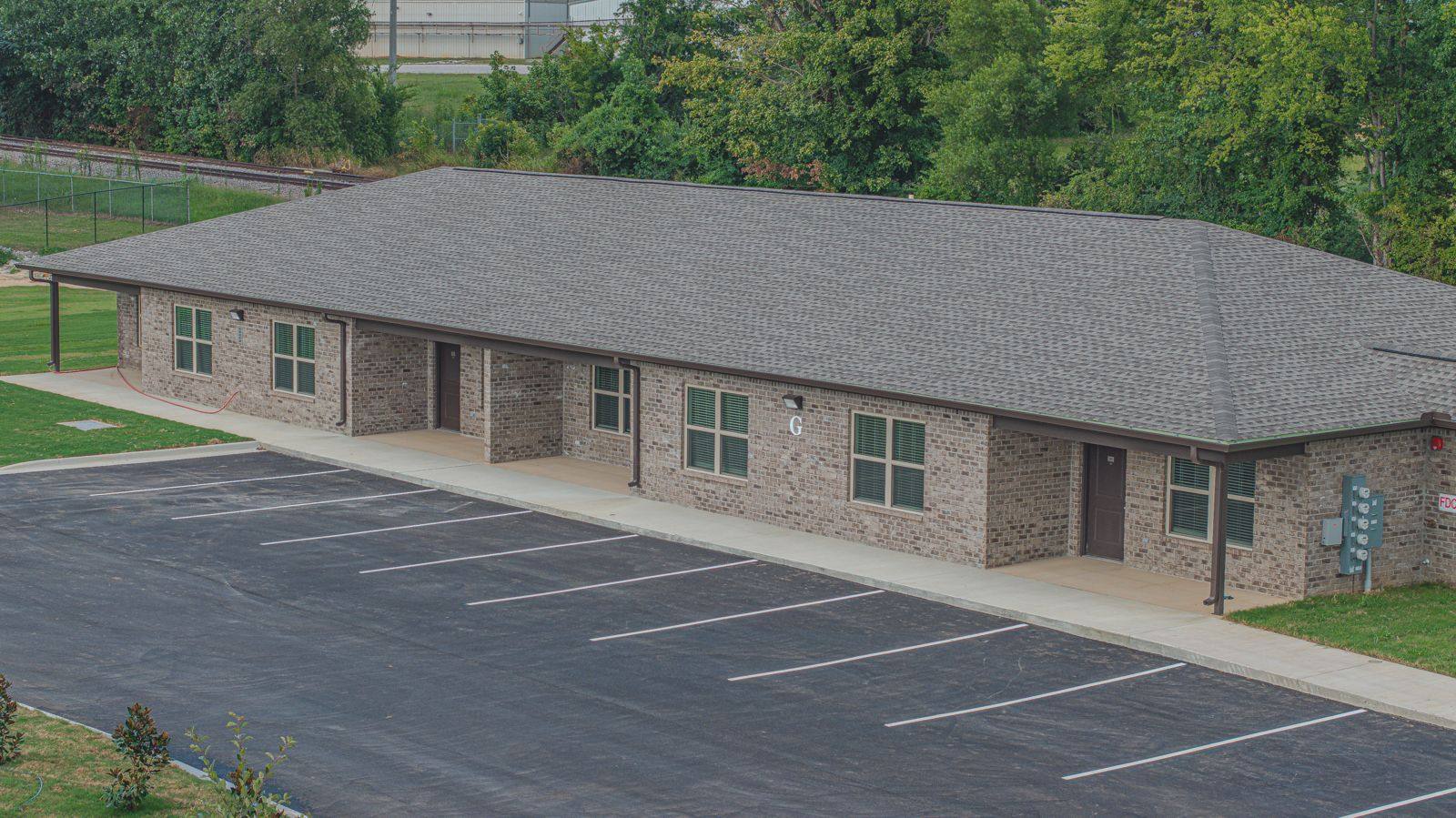 Brick apartment building at The Oaks on Chisholm