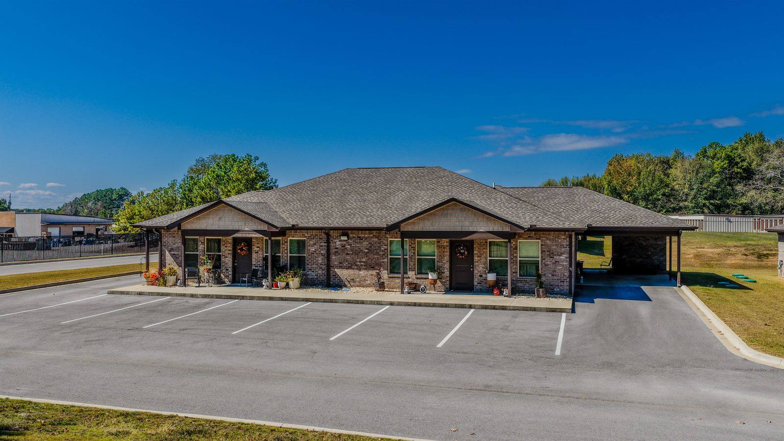 Brick duplex at The Oaks at Oak Court with carports at each end
